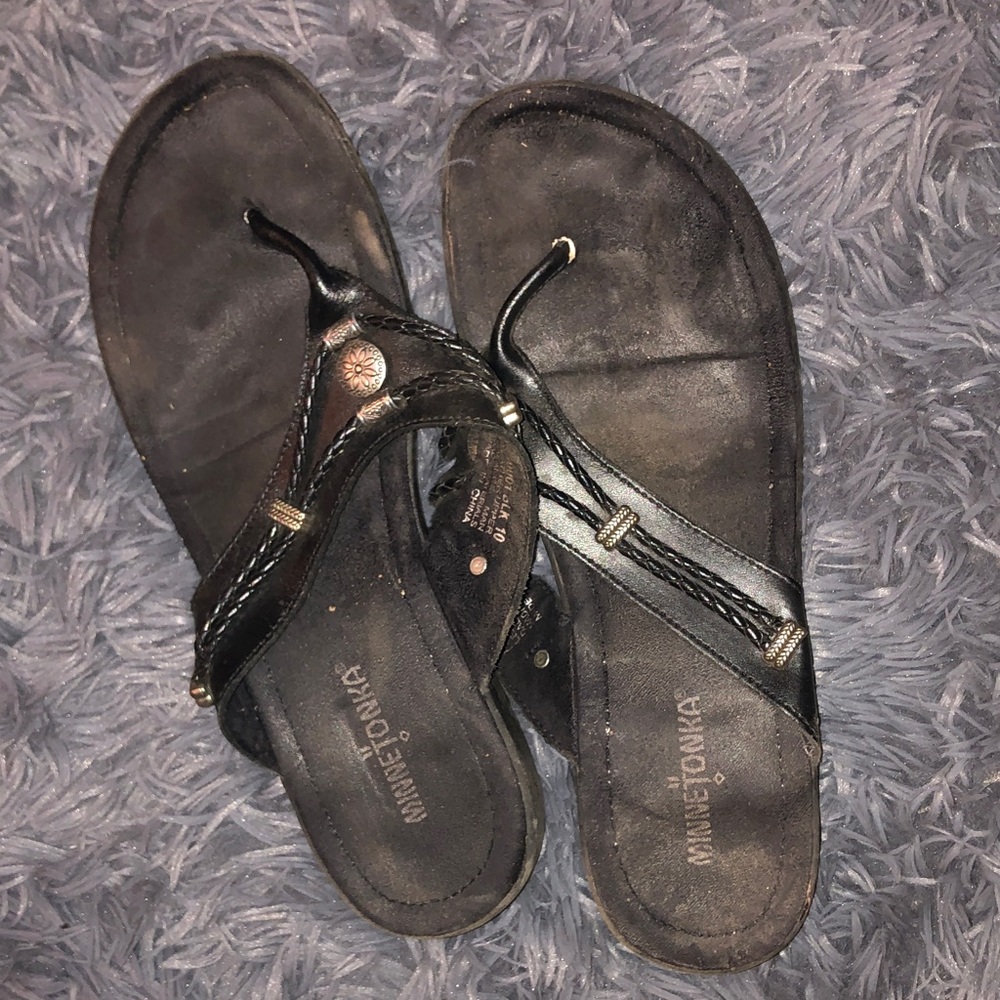 Women’s well worn Minnetonka Black Braided Thong Sandals with Metallic Accents